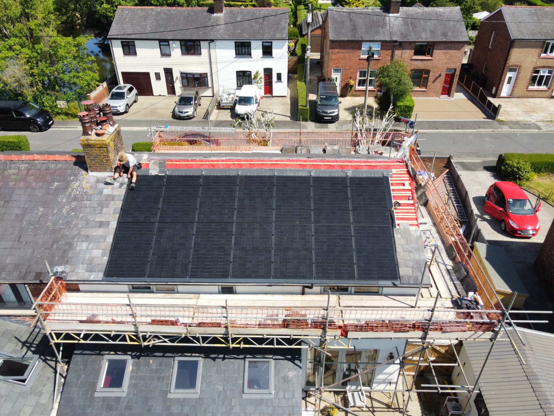 Drone view of 14 solar panels being fitted flush into a slate roof in Longton using a GSE in-roof mounting system